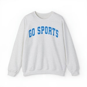 North Carolina Sweatshirt - Unisex Heavy Blend™ Crewneck Sweatshirt GO SPORTS NC Tarheels Coastal Carolina Blue with White