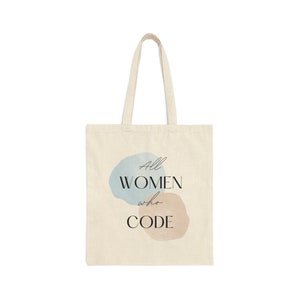 May include: A beige tote bag with a blue and beige abstract design and the text "All WOMEN who CODE".