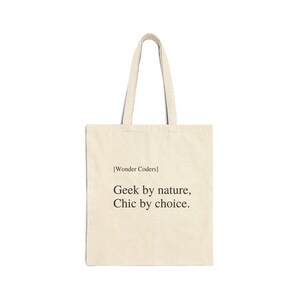 May include: A beige canvas tote bag with the text "[Wonder Coders] Geek by nature, Chic by choice." printed in black.