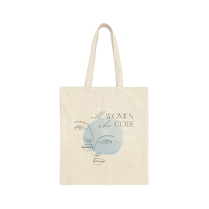 May include: A white canvas tote bag with a blue watercolour design and the text "all women who code".