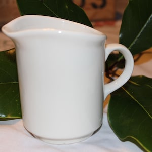 Vintage USA linen color ceramic creamer. Small pitcher