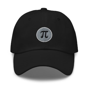 May include: A black baseball cap with a grey circle embroidered with the mathematical symbol pi.