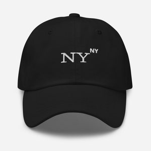 May include: A black baseball cap with a white embroidered "NY" on the front.