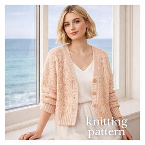 May include: A light peach-coloured knitted cardigan with a V-neck and button closure. The cardigan has a textured pattern and is paired with a white top. The text "knitting pattern" is visible in the image.