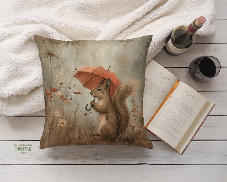 a pillow with a squirrel holding an umbrella