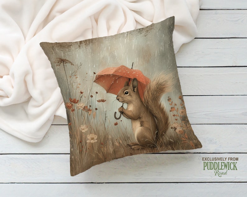 a pillow with a squirrel holding an umbrella