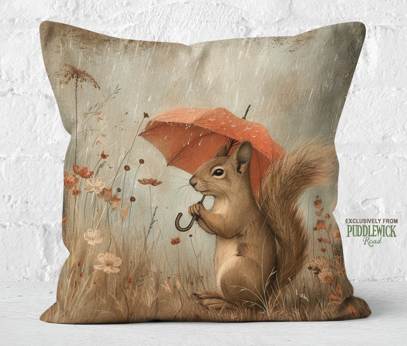 a pillow with a picture of a squirrel holding an umbrella