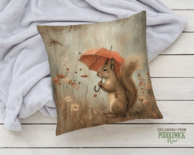 a pillow with a squirrel holding an umbrella