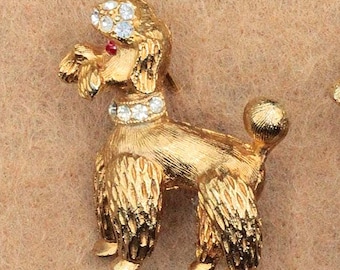 VINTAGE Rhinestone Poodle Brooch • Gold Tone Dog Pin with Clear Rhinestones & Red Eyes • Mid Century Costume Jewelry