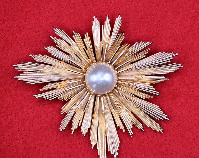 MCM Atomic-Age Starburst Brooch with Pearl Center.