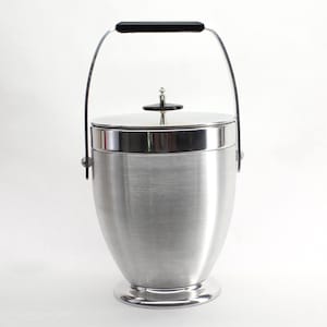 WINTAGE Kromex Deluxe Frigitor Ice Bucket 777-17. Z oryginalnym pudełkiem. Naczynia barmańskie w stylu Mid-Century Modern. Szczotkowane aluminium z uchwytem i pokrywką.
