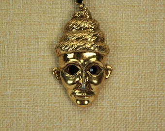 Vintage Gold Tone Guardian Mask Pendant Necklace with Black Rhinestone Eyes – Statement Boho Jewelry