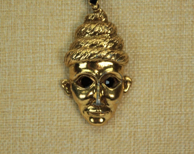 Vintage Gold Tone Guardian Mask Pendant Necklace with Black Rhinestone Eyes – Statement Boho Jewelry