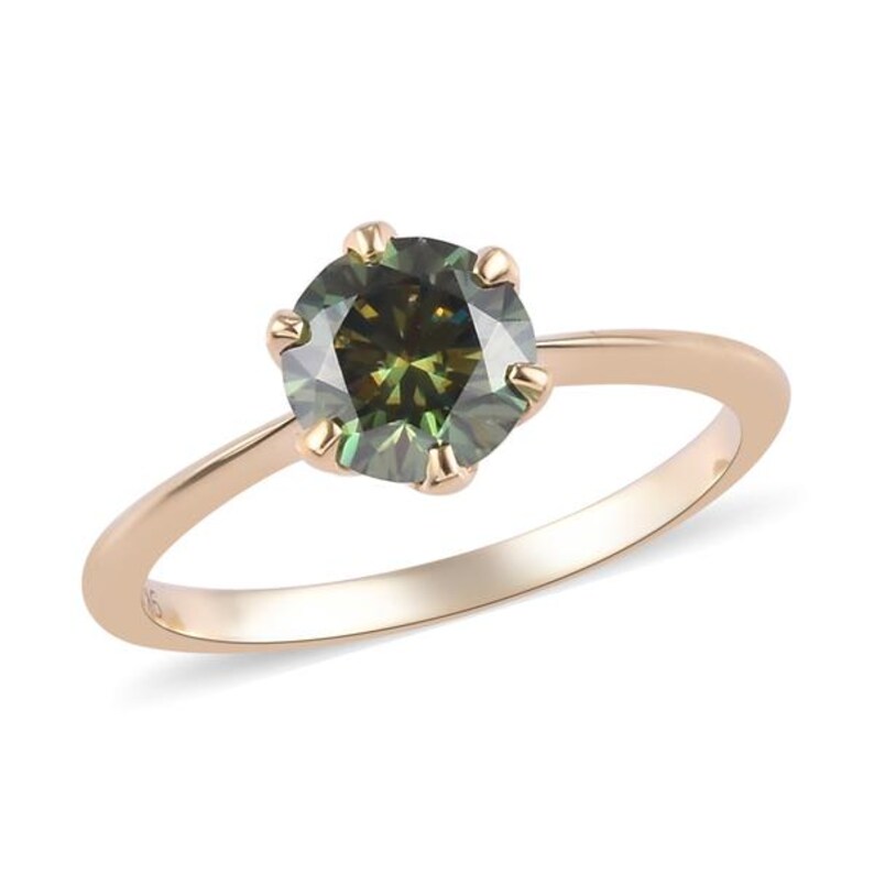 May include: A gold ring with a round, green and black diamond.