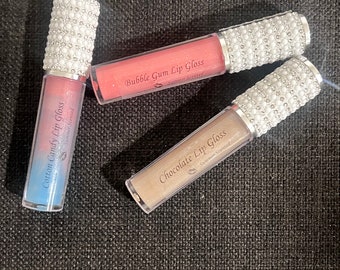 Lip Gloss, chocolate flavor, vanilla flavor, cotton candy flavor, bubble gum flavor moisturizing lip gloss with a touch of a sparkle