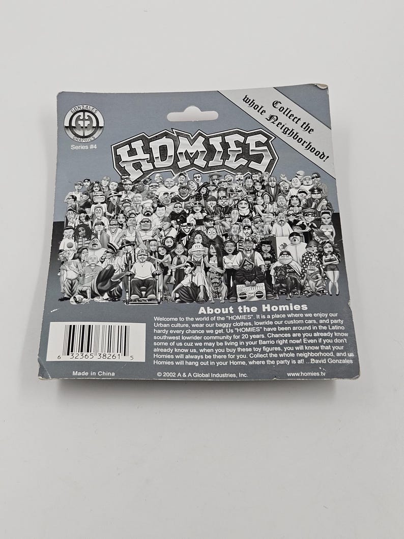 May include: A grey cardboard backing for a Homies collectible toy figure, featuring a crowd of cartoon characters. The text reads "HOMIES" in large letters, with "Collect the whole neighbourhood!" above. Series #4 is also visible.