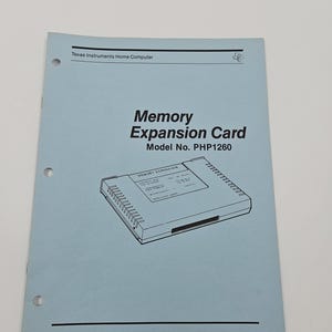 May include: A light blue Texas Instruments Home Computer manual. The cover features the text "Memory Expansion Card" and "Model No. PHP1260". A line drawing of the card is also present.