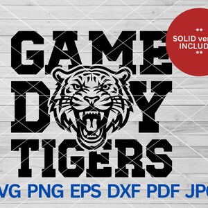 May include: Black and white graphic design with the text "Game Day Tigers" and a tiger head illustration.