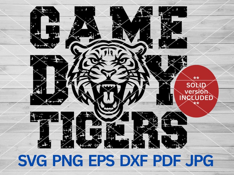 May include: Black and white distressed graphic design with the text "GAME DAY TIGERS" and a roaring tiger head in the center. A red circle with the text "SOLID version INCLUDED" is in the lower right corner.