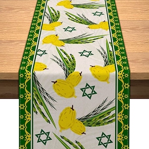 May include: A green and white table runner with a pattern of yellow citron fruit, green palm leaves, and gold stars. The border is green with a gold star pattern.