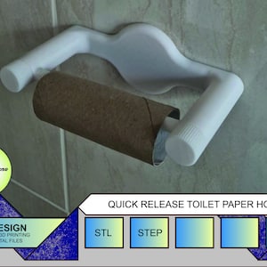 May include: White plastic toilet paper holder with a quick release mechanism. The holder is mounted on a tiled wall and has a roll of toilet paper on it. The text "QUICK RELEASE TOILET PAPER HOLDER" is printed below the holder.