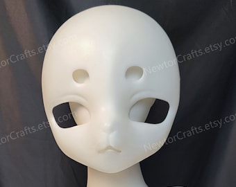 May include: White blank doll head with sculpted facial features, including eyes, nose, and mouth. The head is mounted on a white mannequin torso.