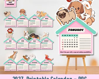 May include: A 2027 printable calendar set featuring twelve house-shaped monthly pages, each decorated with cartoon dog illustrations. The calendar includes a cover page and individual sheets for January through December, displayed on a wooden easel.