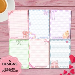 May include: Six notepads with lined pages, featuring pastel borders and decorative elements such as bows, gifts, and floral accents. Each notepad has a unique design and a motivational phrase, including "Believe in you" and "Be bold & bright!" The image also includes the text "6 Designs" and "Instant Download."