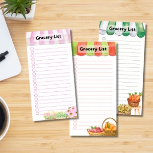 May include: Three printable grocery list templates with a watercolor design. Each list has a different colored awning and a basket of fruit or vegetables at the bottom. The text "Grocery List" is printed on each list.