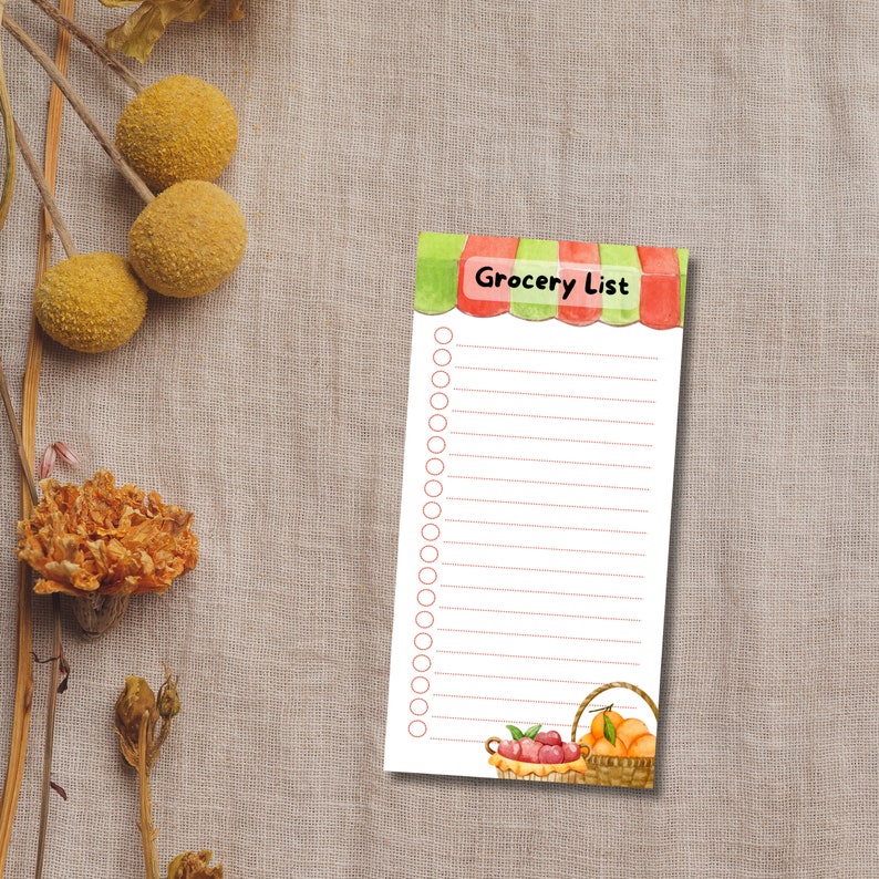 May include: A printable grocery list with a red and green striped awning and a basket of fruit at the bottom. The list has 20 blank lines with circles for checking off items.