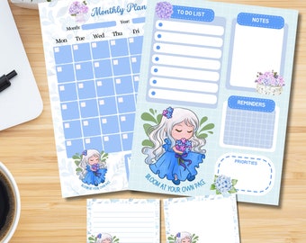 以下が含まれることがあります： 花柄のデザインと「Bloom at your own pace」というテキストが書かれた青と白の印刷可能なプランナー。プランナーには、月間カレンダー、ToDoリスト、メモ、リマインダー、優先順位のセクションが含まれています。
