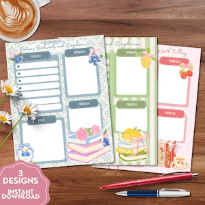 May include: Three vertical planner pages featuring floral and fruit illustrations. The blue page is titled Between Bookmarks and Daydreams, the green page is titled Between Bookmarks and Daydreams, and the pink page is titled Worth Telling.