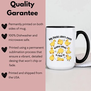 May include: White ceramic mug with a black handle and rim, featuring the phrase "My Ducks don't even know what a row is" and illustrations of yellow cartoon ducks. The mug is printed on both sides.