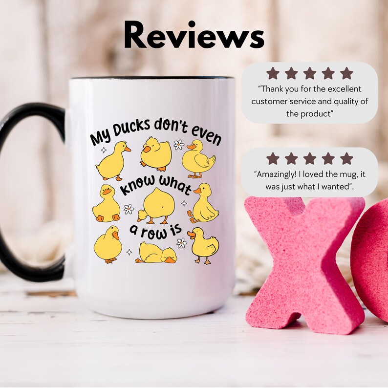 May include: White ceramic mug with a black handle and rim, featuring yellow cartoon ducks and the phrase "My Ducks don't even know what a row is." The mug also includes customer reviews with star ratings.