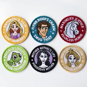 May include: Six round embroidered patches featuring characters from a popular animated film. The patches include images of Rapunzel, Flynn Rider, Maximus, Pascal, Mother Gothel, and Anna. Each patch has a character name and a descriptive phrase.