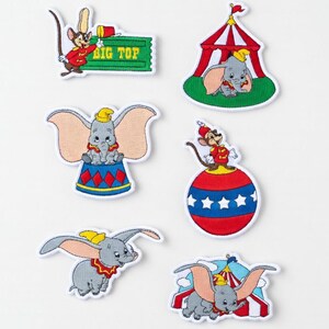 May include: Set of six embroidered patches featuring Dumbo and circus-themed designs. Includes Dumbo on a circus ball, in a circus tent, and flying. Also includes a mouse character and a "Big Top" ticket.