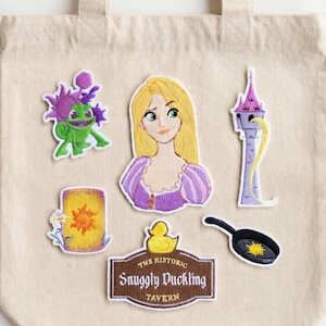 May include: A set of three ceramic mugs with a speckled, matte finish. The mugs are in shades of cream, light gray, and dark gray. Each mug has a simple, minimalist design, perfect for coffee or tea.