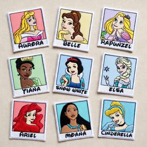 May include: Nine embroidered patches featuring Disney princesses: Aurora, Belle, Rapunzel, Tiana, Snow White, Elsa, Ariel, Moana, and Cinderella. Each patch has a white border and the princess's name below the image.