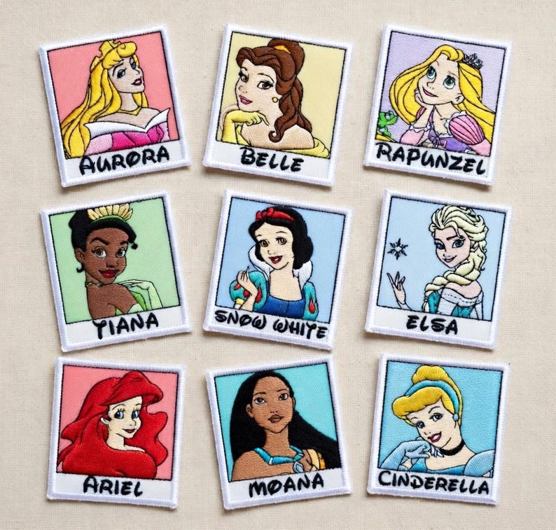 May include: Nine embroidered patches featuring Disney princesses: Aurora, Belle, Rapunzel, Tiana, Snow White, Elsa, Ariel, Moana, and Cinderella. Each patch has a white border and the princess's name below the image.
