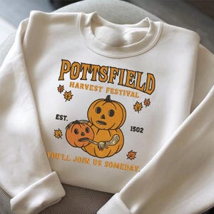 Pottsfield Harvest Festival Pumpkin Carver Embroidered Sweatshirt, Over The Garden Wall Halloween Shirt, Spooky Season Shirt ESN2402