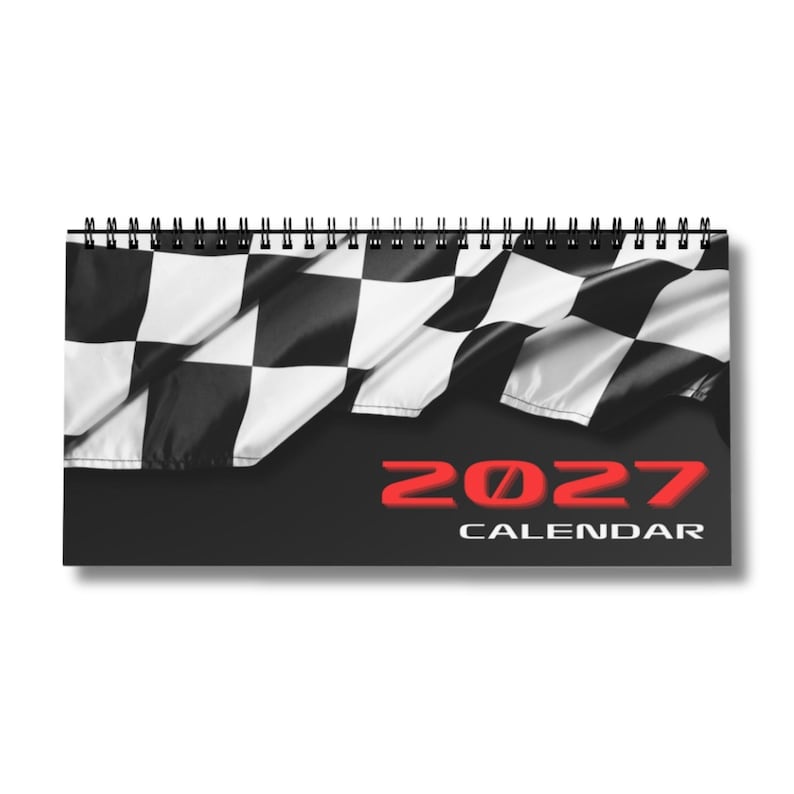 May include: A spiral-bound wall calendar featuring a black and white chequered flag pattern across the top section. The bottom portion is solid black with the red text 2027 and the white text CALENDAR printed clearly on the front cover.