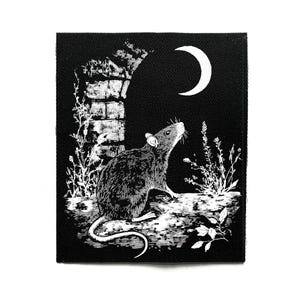 May include: Black and white patch depicting a rat looking up at a crescent moon. The design includes a brick archway and plants. The rat is detailed with fur and whiskers, set against a dark background.