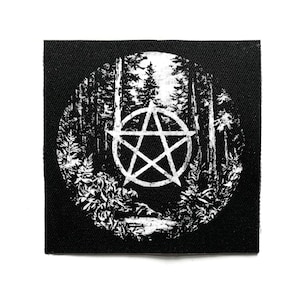 May include: Black square patch with a white pentagram symbol set against a forest backdrop. The circular design depicts trees, plants, and a stream. Ideal for attaching to clothing or accessories.