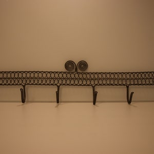 Vintage metal coat rack with 6 hooks