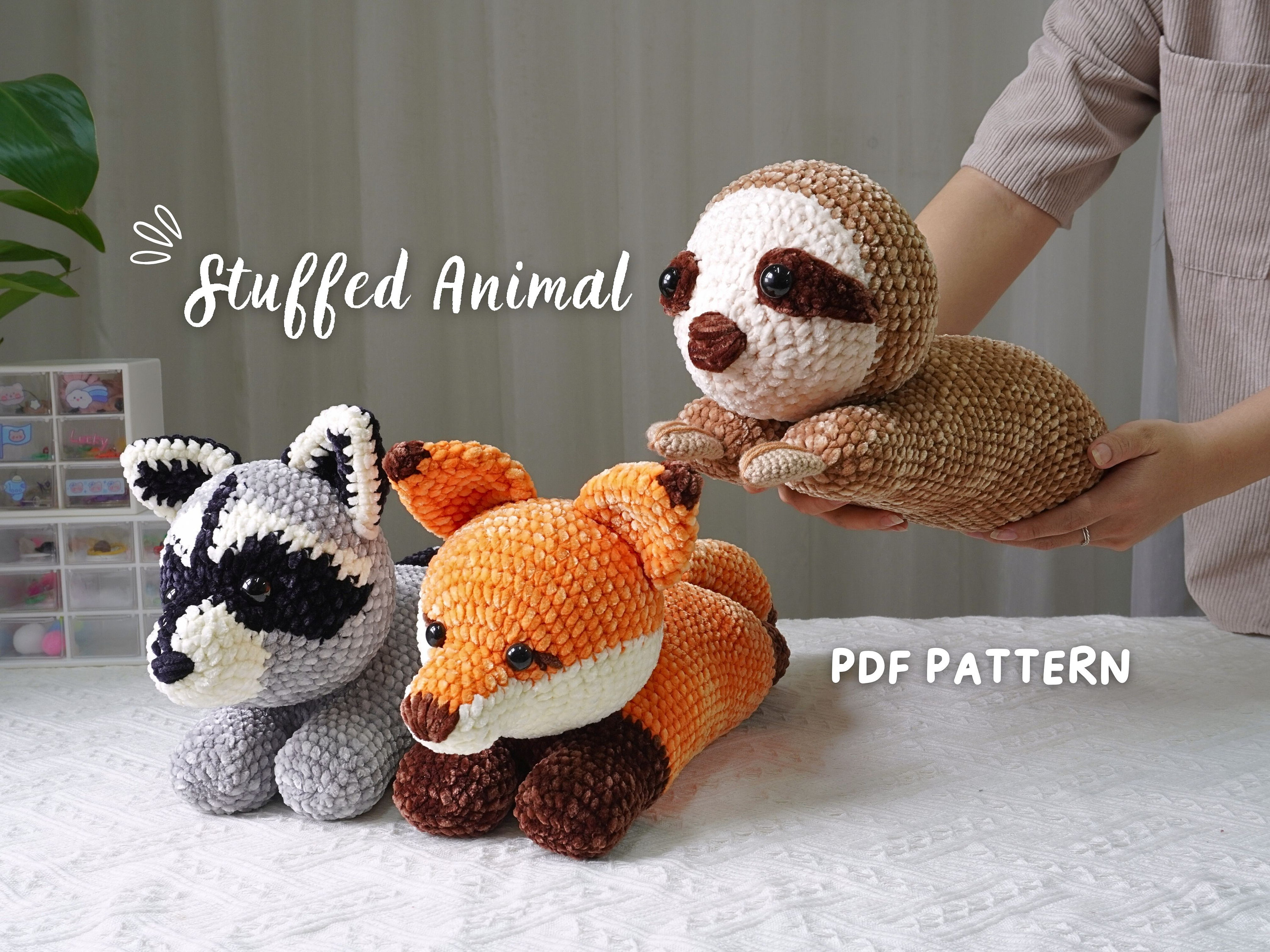 30 Racoon Crochet Patterns for Woodland Amigurumi, Hats, Appliques, and Cozy Handmade... 10 3-in-1 Amigurumi Pattern with Racoon, Sloth, and Fox