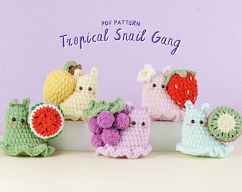 May include: A collection of crocheted snail figures, each adorned with a different tropical fruit. The snails are in various colors, including green, yellow, pink, and blue. The text "Tropical Snail Gang" is displayed above the figures.