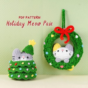 May include: Two handmade crochet cat decorations. One is a cat-shaped Christmas tree with colourful lights, the other a cat in a green wreath with a red bow. The image includes the text "PDF PATTERN Holiday Meow Pair".