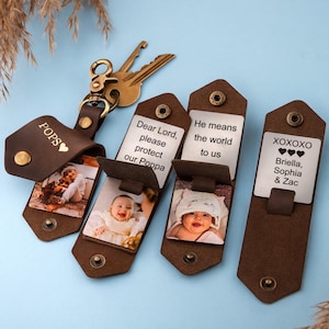 May include: Four brown leather keychains with a metal insert. Each keychain has a different inscription: "POPS", "Dear Lord, please protect our Poppa", "He means the world to us", and "XOXOXO Briella, Sophia & Zac".