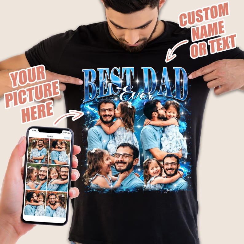 May include: Black t-shirt with a custom design featuring the text "BEST DAD Ever" in blue and white. The design includes a collage of photos. The shirt is being held up by a person.