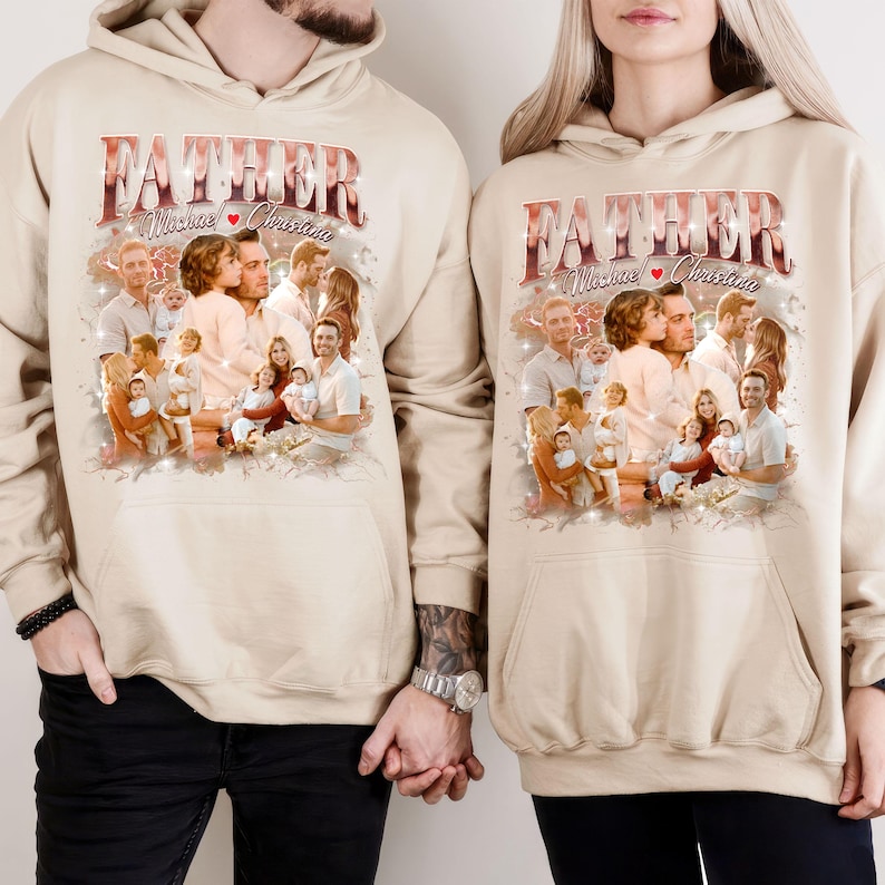 May include: Two beige hoodies with the word "FATHER" in a decorative font. The hoodies feature a collage of family photos. The text "Michael & Christine" is below the word "FATHER". The hoodies are worn by two people holding hands.